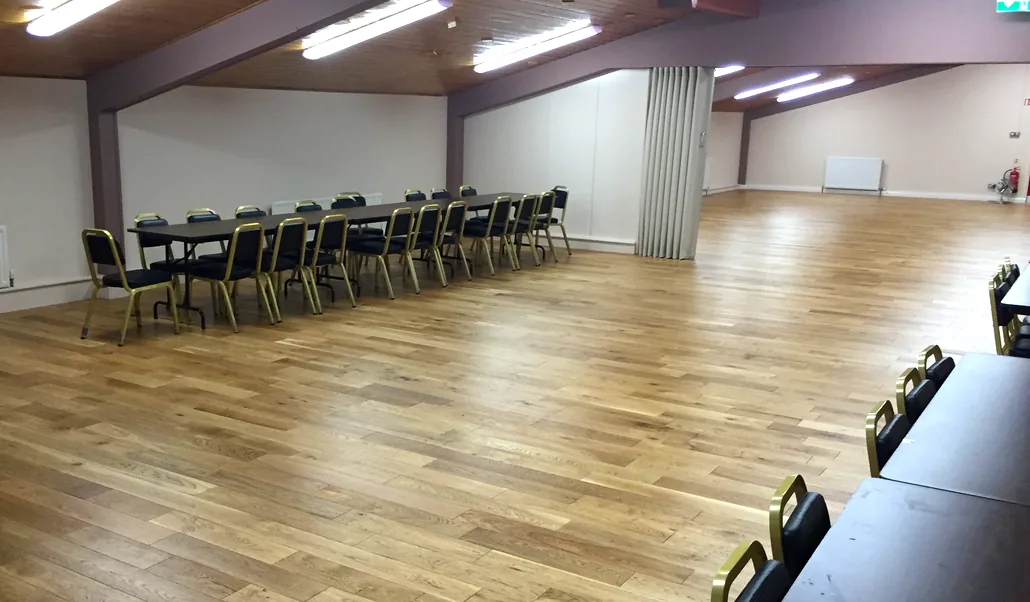 The McConkey Room laid out with a long run of tables and chairs