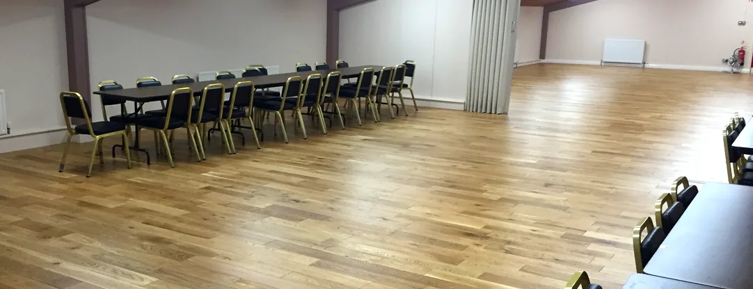The McConkey Room, a long run of tables down one side of a wide wooden floor